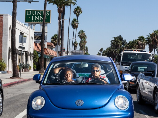A couple is photographed in their car in Hollywood by Jonathan Castillo, as part of his 'Car Culture' series.