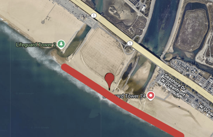 An aerial shot shows a redline across a stretch of beach