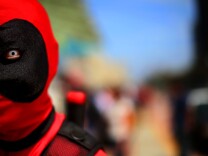File: Stephen Yan dresses as Deadpool at Comic-Con on July 19, 2013 in San Diego.