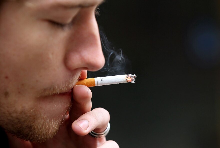 FIle: Isaiah Atkinson smokes a cigarette in front of the San Francisco Centre on May 31, 2011 in San Francisco.