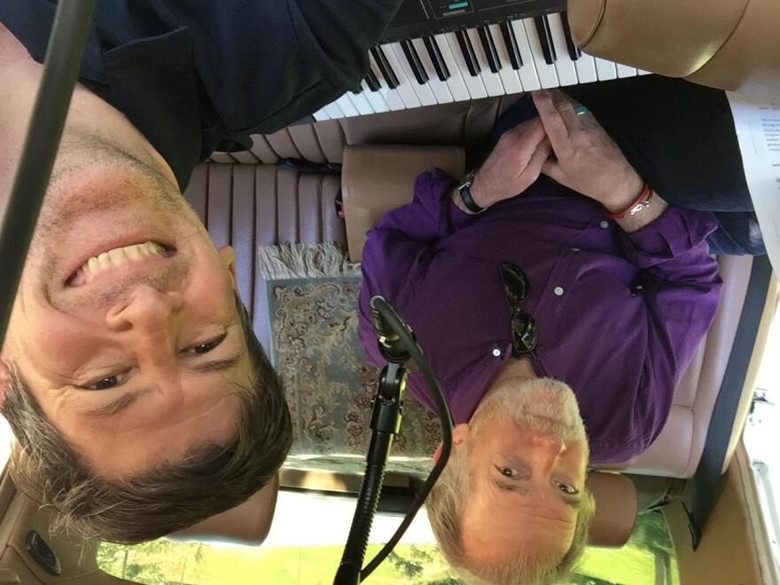 Tom Petty and the Heartbreakers keyboardist Benmont Tench III lumbers into the back of John's car to record his song "Like the Sun (Michoacan)