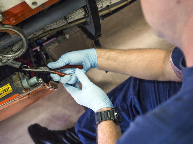 A technician removes float bags for daily inspection at the Coast Guard Air Station at the Los Angeles International Airport on Tuesday morning, March 15, 2015.
