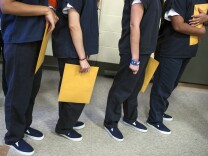 Female detainees get ready to go to immigration court via video feed at the U.S. Immigration and Customs Enforcement's Detention Facility in Adelanto on Friday, Sept. 2, 2016.