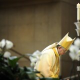 Archbishop Jose Gomez bows his head during a Ceremony of Transition as Archbishop at the Cathedral of Our Lady of the Angels.
