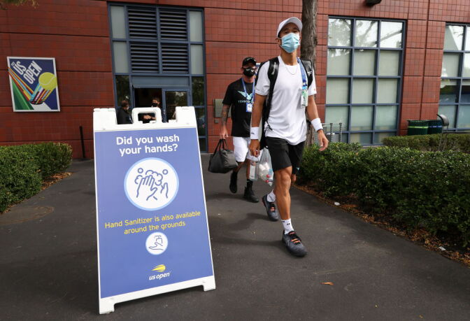 NEW YORK, NEW YORK - AUGUST 31: A player wears a face covering as he walks the grounds on Day One of the 2020 US Open at the USTA Billie Jean King National Tennis Center on August 31, 2020 in the Queens borough of New York City. (Photo by Al Bello/Getty Images)