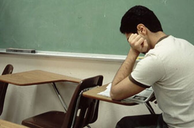 A student sits in detention.