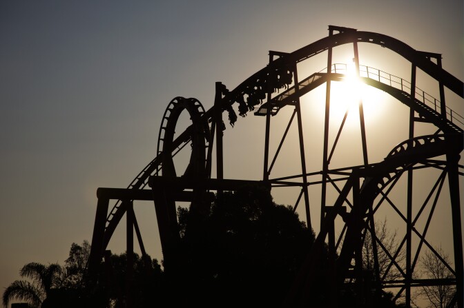 People enjoy a ride in a roller coaster  on May 23, 2010 at the Gold Reef Theme Park in Johannesburg, South Africa. Africa's greatest theme park was created around an authentic 19th century Gold mine. This mine once kept the world record for the amount of gold recovered as well as the shaft sinking record in 1916. South Africa will host the FIFA WC2010 from the 11 of June to the 11 of July, 2010..AFP PHOTO/GIANLUIGI GUERCIA (Photo credit should read GIANLUIGI GUERCIA/AFP/Getty Images)