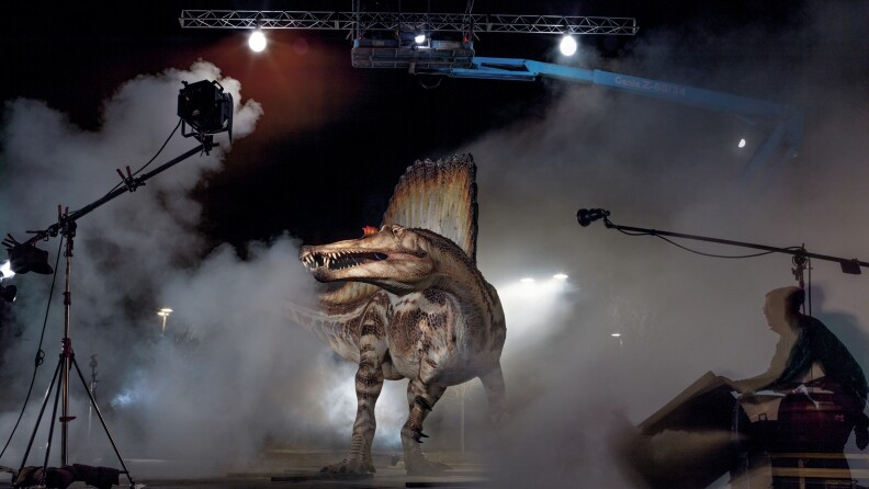 Who's your daddy? A model of the Cretaceous predator spinosaurus gets rock star treatment during a photo shoot for the October issue of <em>National Geographic</em>.