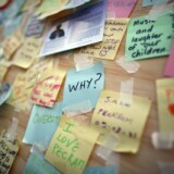 A boarded up window of a discount store in Peckham carries notes of peace on August 10, 2011 in London, England.