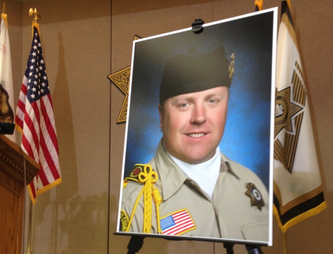 Slain Sheriff's Deputy Jeremiah MacKay, who was allegedly killed in a gunfight with suspected murderer Christopher Dorner. This poster was displayed at a San Bernardino Sheriff's Department press conference.