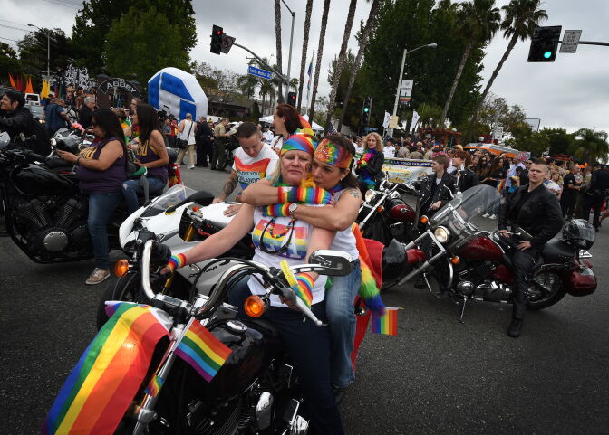 Participants take part in the 2016 L.A. Pride Festival parade in West Hollywood on June 12, 2016.