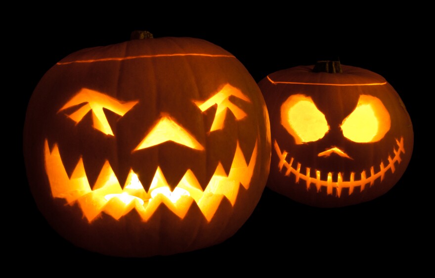 Jack-o'-lanterns carved from pumpkins and lit with tea lights
