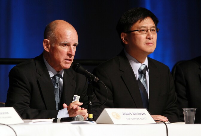SACRAMENTO, CA - DECEMBER 08:  California state controller John Chiang (R) looks on as California governor-elect Jerry Brown speaks during a briefing on California's state budget on December 8, 2010 in Sacramento, California. With less than one month before being sworn into office, California governor-elect Jerry Brown held a bi-partisan meeting on California's state budget.  (Photo by Justin Sullivan/Getty Images) *** Local Caption *** Jerry Brown;John Chiang