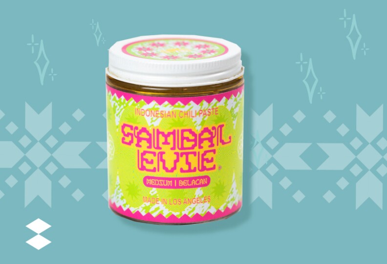 A small jar against a white background with a multi-colored label containing pink, green, yellow on it