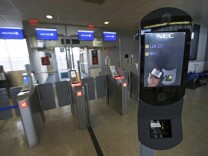 File: A U.S. Customs and Border Protection facial recognition device is ready to scan another passenger at a United Airlines gate, Wednesday, July 12, 2017, at George Bush Intercontinental Airport, in Houston.
