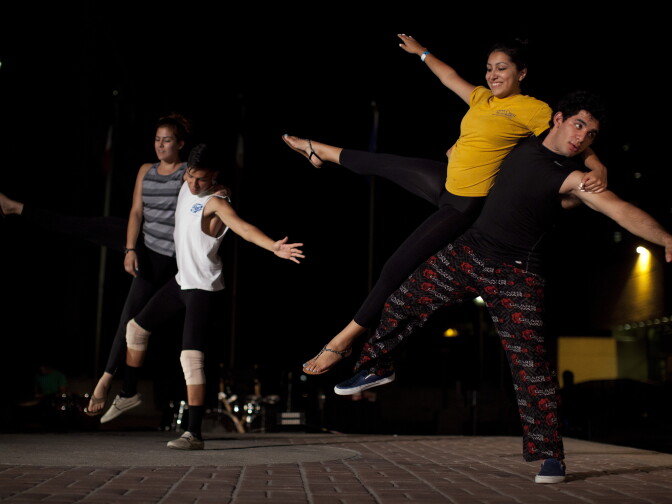 Dancers practice their routine for The Long Road Today, a play that will be performed outdoors in four different locations at the Santa Ana Civic Center Plaza.