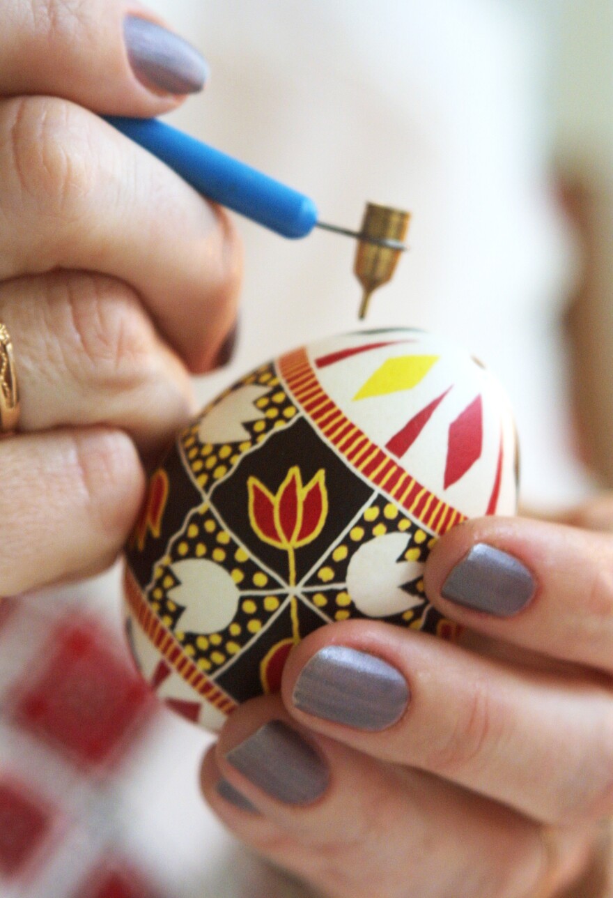 Famous Ukrainian Easter egg artist Galina Ivanets paints her creation with a writing pin in her workshop in Kiev, Ukraine. <em>"Pysankarstvo</em>" — the art of painting Easter eggs — has enjoyed a renaissance as part of the religious and cultural awakening in post-Soviet Ukraine following decades of state-sponsored atheism.