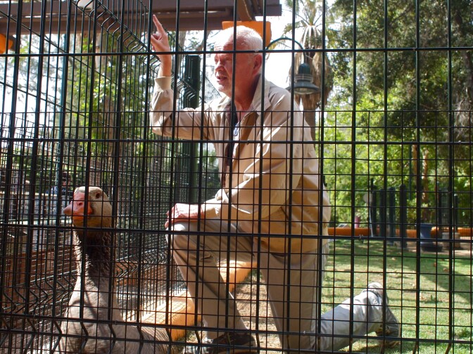 Dominic Ehrler and Maria/Mario the goose greet visitors to the Winnick Family Children's Zoo at the Los Angeles Zoo