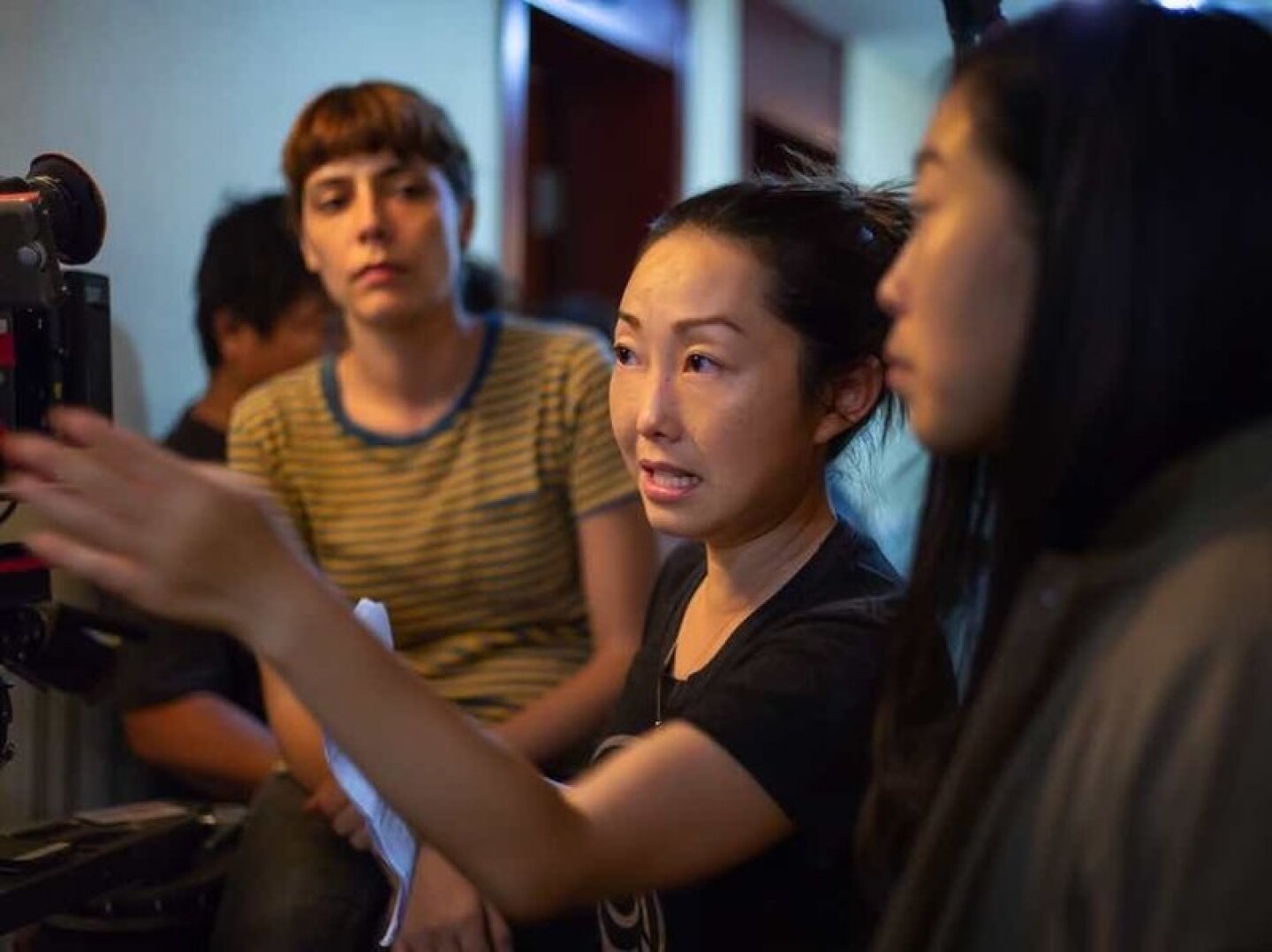 Lulu Wang, center, directing a scene from "The Farewell."