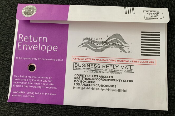 A close-up of an official ballot envelope. On the left side is a small hole. 