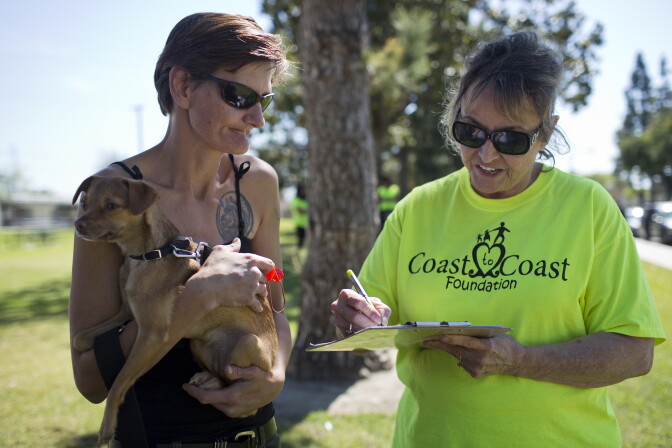 Volunteer Marge Preston, right, works with Angela Colantuono during a weekly outreach assessment put on by the Coast to Coast Foundation in partnership with the Fullerton Police Department on Thursday, March 5, 2015 at Pacific Drive Park. Colantuono has been homeless in Fullerton for seven years. She asks for help with health insurance on Thursday.