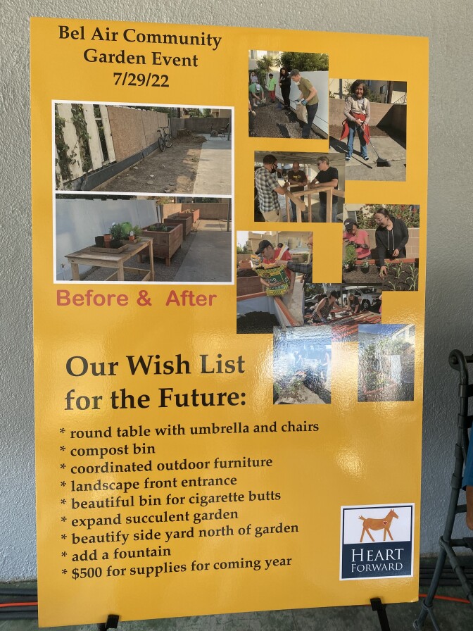 A yellow poster lists the the Bel Air Guest Home community garden wish list, which includes a compost bin, a bin for cigarette butts, an umbrella, table and chairs. 