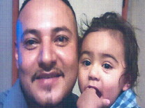 Giovanny Santiago, pictured with son Jayden, is wanted by police for attempted murder and kidnapping.  