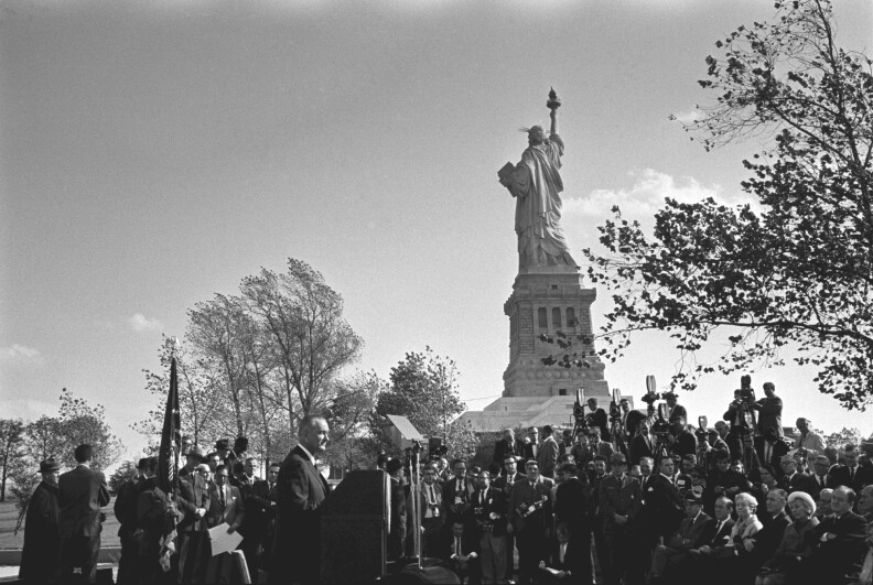 President Lyndon Johnson gives remarks before the signing of the Immigration and Nationality Act, October 3, 1965 on Liberty Island, New York City.
