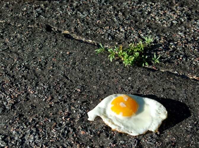 Hot enough to fry an egg on the sidewalk? Probably not — this one was cooked inside first.