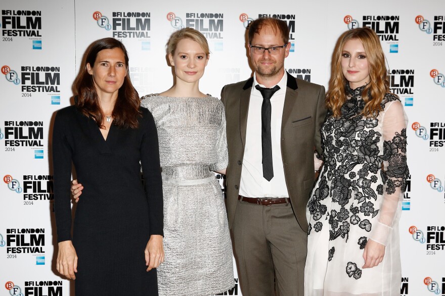 LONDON, ENGLAND - OCTOBER 11:  Director Sophie Barthes, actor Mia Wasikowska, producer Joe Neurauter and actor Laura Carmichael attend the red carpet arrivals of "Madame Bovary" during the 58th BFI London Film Festival at Odeon West End on October 11, 2014 in London, England.  (Photo by Tim P. Whitby/Getty Images for BFI)