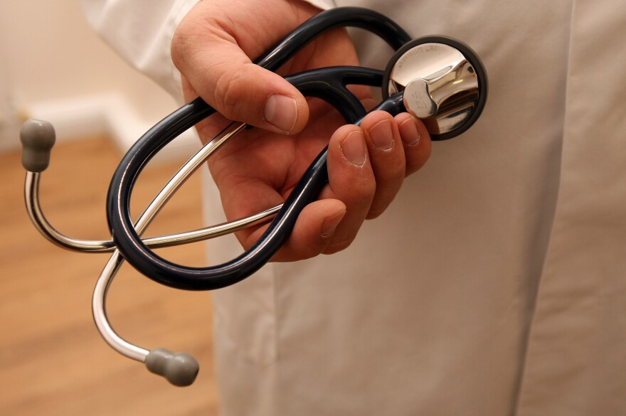 BERLIN, GERMANY - SEPTEMBER 05:  A doctor holds a stethoscope on September 5, 2012 in Berlin, Germany. Doctors in the country are demanding higher payments from health insurance companies (Krankenkassen). Over 20 doctors' associations are expected to hold a vote this week over possible strikes and temporary closings of their practices if assurances that a requested additional annual increase of 3.5 billion euros (4,390,475,550 USD) in payments are not provided. The Kassenaerztlichen Bundesvereinigung (KBV), the National Association of Statutory Health Insurance Physicians, unexpectedly broke off talks with the health insurance companies on Monday.  (Photo by Adam Berry/Getty Images)
