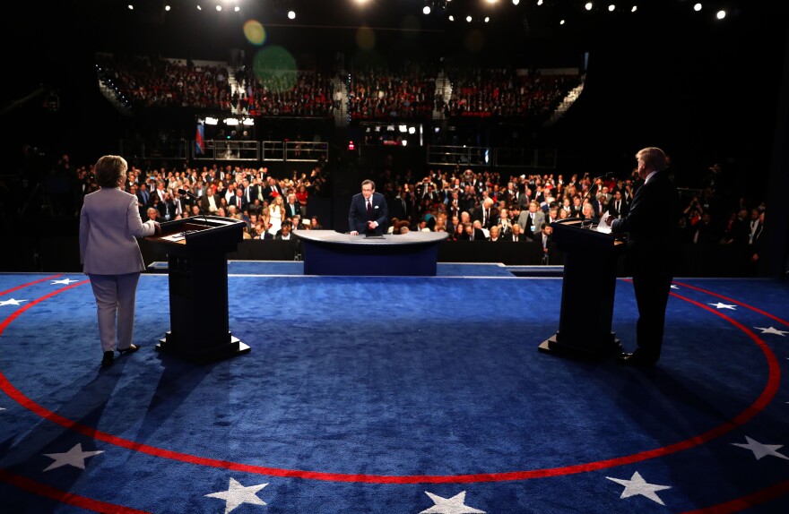 Democratic nominee Hillary Clinton (L) and Republican nominee Donald Trump salute the audience at the end of the final presidential debate at the Thomas & Mack Center on the campus of the University of Las Vegas in Las Vegas, Nevada on October 19, 2016.
Democrat Hillary Clinton and rival Donald Trump face off in their last presidential debate on October 19, with the Republican candidate spiraling downward amid allegations of sexual misconduct and wild charges of a "rigged" US election. / AFP / POOL / joe raedle        (Photo credit should read JOE RAEDLE/AFP/Getty Images)