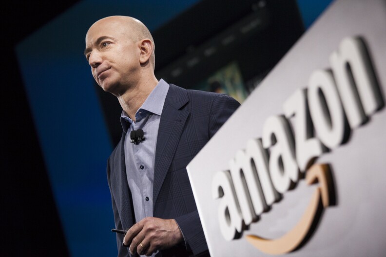 SEATTLE, WA - JUNE 18: Amazon.com founder and CEO Jeff Bezos presents the company's first smartphone, the Fire Phone, on June 18, 2014 in Seattle, Washington. The much-anticipated device is available for pre-order today and is available exclusively with AT&T service.  (Photo by David Ryder/Getty Images)