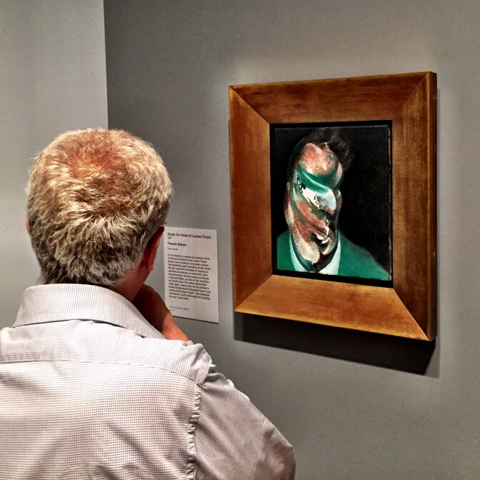 A visitor to the Getty Museum at the opening of London Calling checks out "Study for Head of Lucian Freud," 1967, by Francis Bacon.