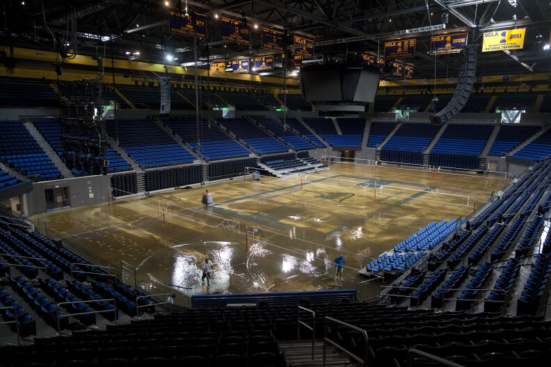Water covers the court inside the Pauley Pavilion after a broken water main flooded the UCLA campus July 29, 2014.