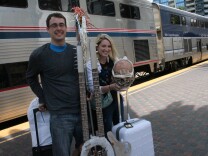 Cosplayers Spencer Kelsey and Lacy Reinbold took the train to Comic-Con 2015 in San Diego -- with 'Mad Max' flame thrower guitar in tow. 