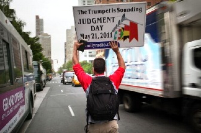 Participants in a movement that is proselytizing that the world will end this May 21, Judgment Day, walk down the middle of the street on May 13, 2011 in New York City.