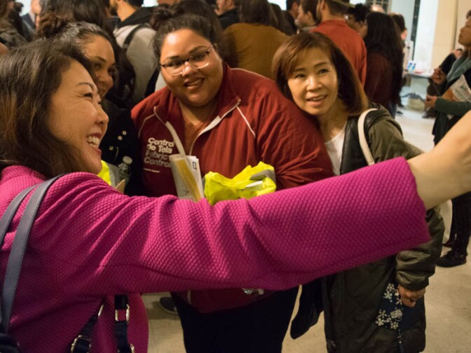 Hyepin Im snaps a selfie with several acquaintances before the 2018 Koreatown Homeless Count on Jan. 25, 2018. Im stops at several public events per week in her duties as a representative of the Korean Christian community with Faith and Community Empowerment (FACE).