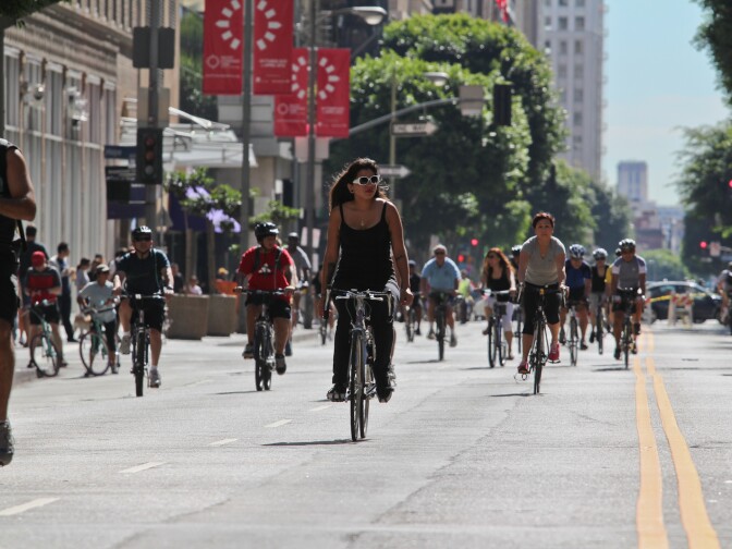 Cyclists ride through the street at CicLAvia in downtown L.A. October 9, 2011.