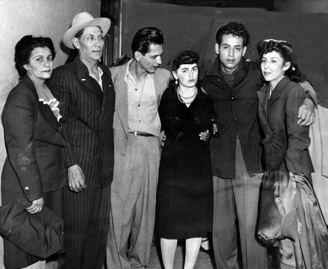 Henry Leyvas, 21, and Gus Zammora, 22, two of the eight youths who were released from the County Jail, Monday, October 29, 1944 with all charges dismissed, after serving two years on conviction in the "Sleepy Lagoon" murder, are shown as they were greeted by relatives and friends. Left to right, Mrs. Lupe Leyvas, Seferino Leyvas, Henry Leyvas, Alice Greenfield, Gus Zammora and Ruth Amparay. 