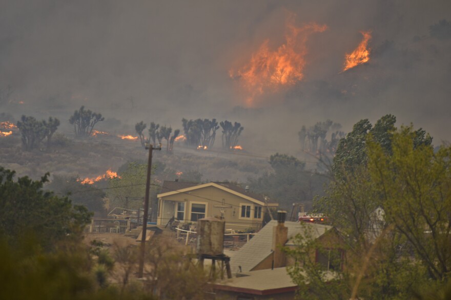 The Blue Cut Fire exhibiting heavy fire behavior and threatening homes off Highway 138 on Wednesday afternoon, Aug. 17, 2016.