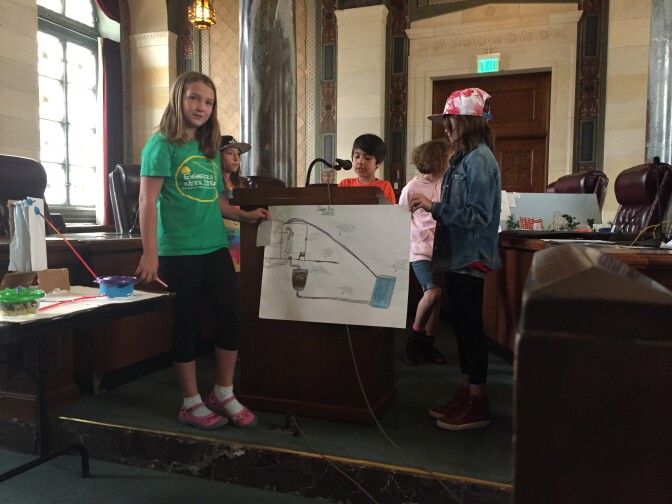 Another group of fourth graders from Los Feliz Charter School for the Arts presents their system to gather waste water from showers and filter it for reuse.