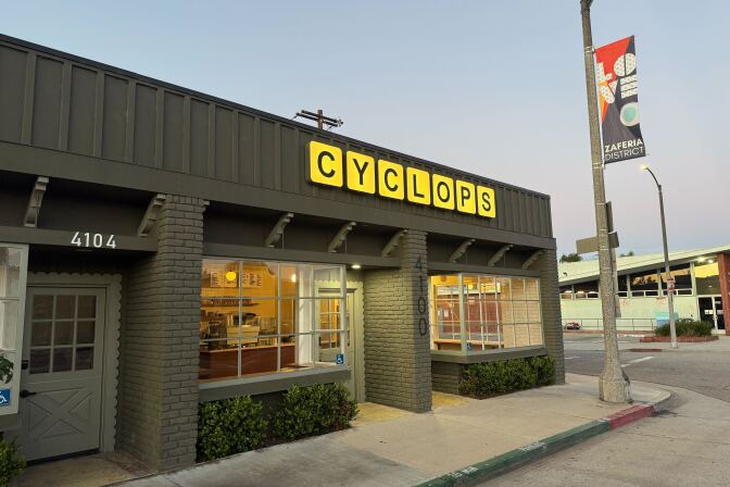 exterior of a building, with a sign that says "cyclops" in capital letters.
