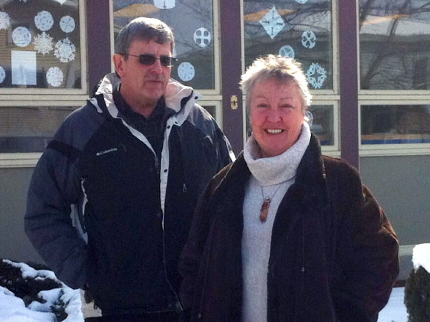 Terry Tatro and Irene Clarke stand in front of the People's United Bank branch on Main Street in Alburgh, Vt. The two feared that the bank's closing would leave a gaping hole in their community.