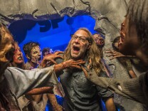 File: Greg Nicotero, co-executive producer and director of special effects make-up artist for AMC's "The Walking Dead," found himself surrounded by a horde of walkers at Universal Orlando's Halloween Horror Nights 24 on Oct. 25, 2014 in Orlando, Florida.