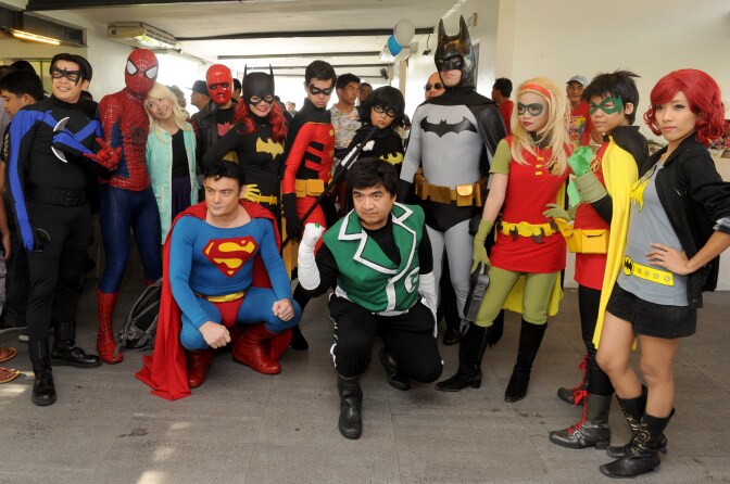Comic enthusiasts dressed as comic book characters including Batman, Spiderman and Superman pose for photos as they attend a Free Comic Book Day event in Manila, Philippines on May 3, 2014.