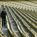 A police officers walks in the seats before the game between the San Francisco Giants and the Los Angeles Dodgers on May 18, 2011 at Dodger Stadium in Los Angeles, California.
