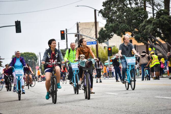 People on their bikes at a Beach Streets event in Long Beach.