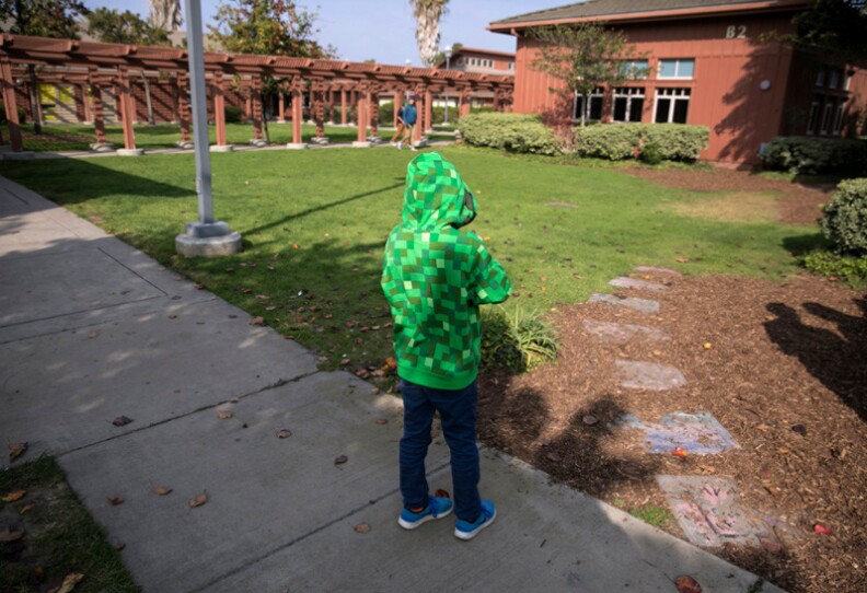 A child stands on the grounds of the Casa Pacifica Centers for Children and Families in Camarillo (Ventura County)