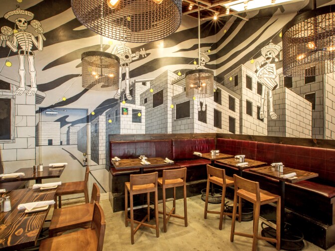 A mural by Carlos Nieto inside Mercado Restaurant uses two walls to create a "3D" effect for diners. 